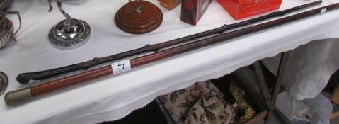 A Lincoln regiment stick and another cane.