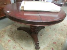 A Victorian mahogany circular dining table.