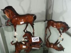 A Beswick horse and 2 Beswick foals.