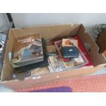 A good mixed lot including 2 postcard albums, postcards, dice, card games etc.