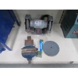 A PP150Bg Performance power grinder, spare grinding discs and a small bench vice.