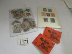 A small collection of stamps including penny black and several penny reds.