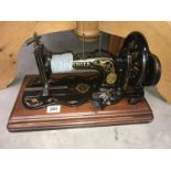 A cased Singer sewing machine.