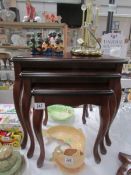 A nest of 3 mahogany tables,.