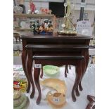 A nest of 3 mahogany tables,.