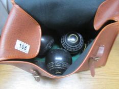 A set of 4 lawn green bowls in bag.