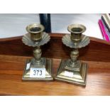 A pair of brass candlesticks