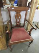 A mahogany elbow chair,.