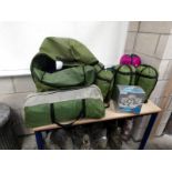 A 4 man tent with 6 sleeping bags,