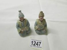 A pair of 19th century miniature nodding figures.