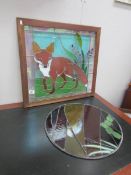 A stained glass panel depicting a fox and a circular stained glass panel.