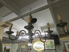 A 5 lamp brass ceiling light.