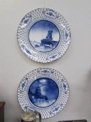 A large pair of Delft Dutch scene chargers (both are chipped.).