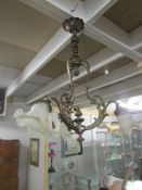 An ornate 3 lamp ceiling light,.