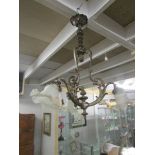 An ornate 3 lamp ceiling light,.