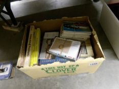 A mixed lot including postcards, P.H.Q., Stamp catalogues etc.