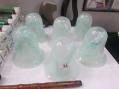 A set of 6 heavy glass lamp shades.
