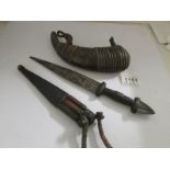 An old dagger and a horn shaped leather powder flask.