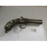 A 19th century pepperpot pistol with inlaid stock.