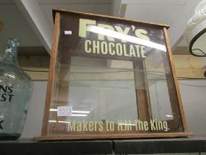 A display cabinet with Fry's adverting lettering.