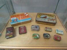 A mixed lot of old tins including gramaphone needle tins with needles.