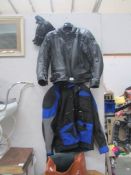 A leather motorcyle jacket, leather gloves and another jacket.