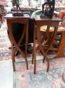 A pair of unusual legged tables