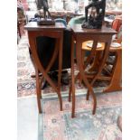 A pair of unusual legged tables