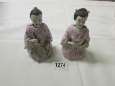 A pair of 19th century nodding head Chinese figures.