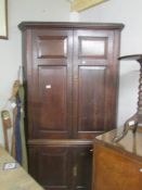 An oak corner cupboard.