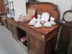 A Victorian mahogany twin pedestal sideboard.