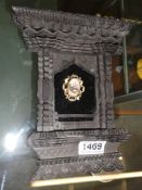 An ornately framed Victorian mourning brooch,