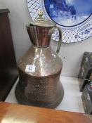 A middle eastern copper lidded gourd jug with brass fittings.