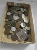 A mixed lot of foreign coins from 18th, 19th and 20th century and UK coins.