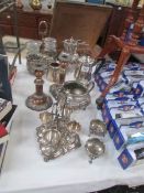 A mixed lot of silver plate including candlesticks, egg cup set, tea ware etc.