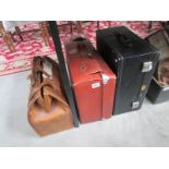 3 vintage suitcases.