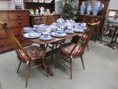 An Ercol dining table and 4 chairs,