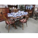 An Ercol dining table and 4 chairs,