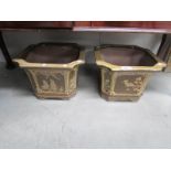 A pair of pottery planters with various floral and nature depictions.