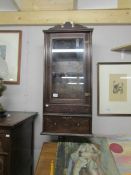 An Edwardian oak display cabinet with single drawer.