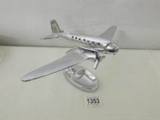 A chromed model airplane.