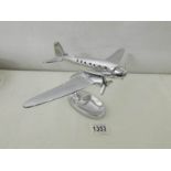 A chromed model airplane.