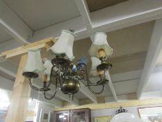 A 6 lamp brass ceiling light.