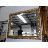 An ornate bevel edged mirror