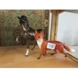 A large Beswick fox and a Beswick horse with raised leg.