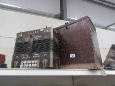 An old Vulkan accordion in wooden case.