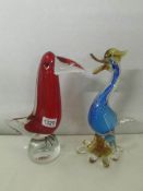 A heavy red glass Murano glass bird and a heavy blue glass Murano duck.