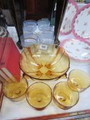 An amber glass fruit bowl with 4 dishes and 6 glass sundae dishes.