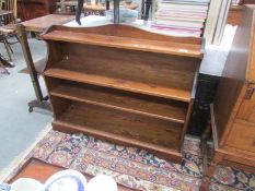 A stained pine book case.