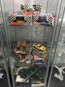 9 1960's Scalextric cars including Mini, Aston Martin etc, some with original boxes.